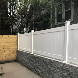 After: Foundation sealed, retaining wall built for a patio