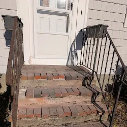 Before: Front steps repaired and refaced