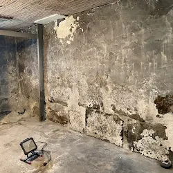 Before: Basement walls repointed and parged