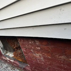 Before: Old basement brick wall repointed