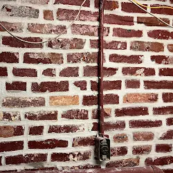 After: Old basement brick wall repointed